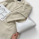 Lora. - Blizgi odinė rankinė